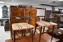 A pair of Edwardian mahogany bedroom chairs having line inlay decoration