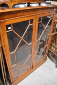 A reproduction yew wood bookcase, width approx. 101cm