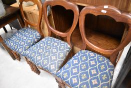 A set of three Victorian mahogany balloon back dining chairs