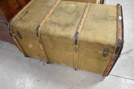 A vintage canvas covered travel trunk, labelled Albion , width approx. 83cm