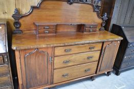 A Victorian mahogany sideboard having ornate ledge back, width approx. 190cm