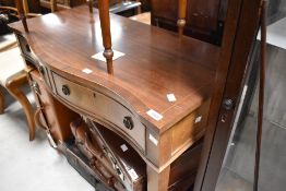 A reproduction Regency serpentine front side table