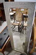 A modern full length wall mirror, having silvered pattern, approx. 132 x 46cm