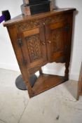 A Priory style oak corner cupboard , approx height 97cm