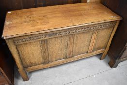 An early to mid 20th Century oak bedding box, width approx. 106cm