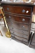 A reproduction Regency style serpentine front narrow chest of six drawers, height approx. 99cm