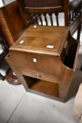A vintage stained ply sewing trolley, height approx. 62cm
