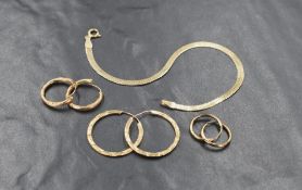 A 9ct gold snake link chain bracelet, marked 375, 18cm, along with three pairs of yellow metal hoops