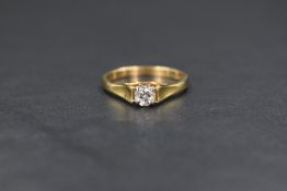 An 18ct gold diamond set solitaire ring, the diamond measuring approximately 0.50ct having good