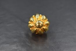 A gold plated costume ring by Kenneth Jay Lane (new York) of cushioned dome form, size L/M