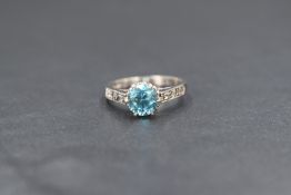 A 9ct white gold and blue topaz set solitaire ring, the topaz measuring approximately 1ct in a