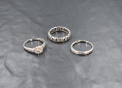 A silver and cubic zirconia cluster ring and band wedding set, the illusion set cluster ring with
