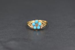 A yellow metal presumed gold turquoise, diamond and seed pearl set ring, the central diamond chip in