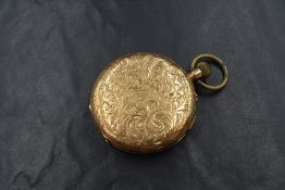 A yellow metal hunter top wound pocket watch stamped 14K having Roman numeral dial and engraved