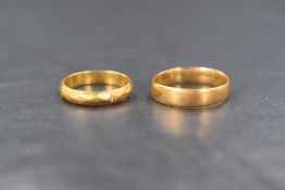 Two 22ct gold wedding bands, marked 22 with hallmarks, sizes G & L and approximately 4.4g total