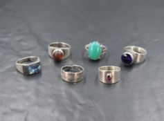 Six silver rings of various forms including artisan made by Sidney Beddall of Ambleside, Mexican