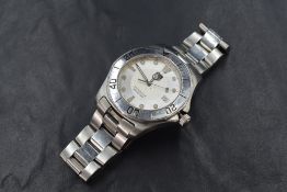 A gent's Tag Heuer professional 300meters Aquaracer quartz wrist watch having dot and baton dial
