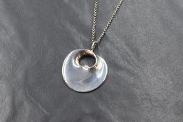 A Danish silver Georg Jensen hidden heart pendant with chain designed by Vivianna Torun, with case