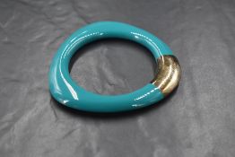 A Braybrook & Britten dark turquoise coloured resin and silver, shaped bangle, with box