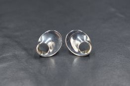 A pair of Danish silver Georg Jensen Mobius design stud earrings number 142, designed by Vivianna