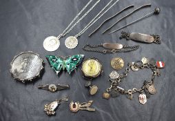 A small selection of silver and white metal jewellery including ID bracelets, locket brooch,