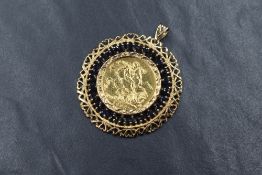 A Victorian sovereign dated 1892, in a decorative 9ct gold removable pendant mount having a border
