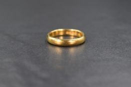 A 22ct gold wedding band of plain form, marked 22 with hallmarks, size P & approximately 5.7g