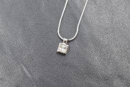 A 9ct white gold pendant having a princess cut Cubic Zirconia on a 9ct white gold snake link