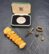 A cased silver National Trust 25years service medal bearing presentation name to edge, a carved