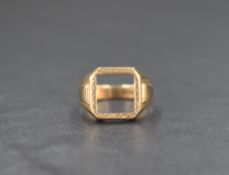 A 9ct gold signet ring having a vacant square panel with a decorative engraved border and moulded