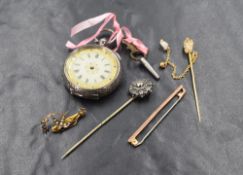 A small continental silver key wound pocket watch having a Roman numeral dial on a gilt decorated