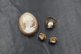 A matched suite of cameo jewellery including a brooch with pendant loop, ring and pair of