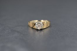 A 9ct gold diamond set solitaire ring, the round brilliant cut illusion set diamond with