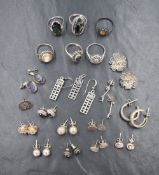 A selection of silver and white metal earrings and rings including crystal, hematite, cameo,