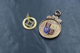 A 9ct rose gold medallion having enamelled Royal Coat of Arms shield to front and monogram en verso,