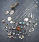 A vintage metal lined wooden box containing a small selection of silver and white metal jewellery