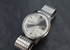 A Seiko Sportsmatic automatic wristwatch, the silver dial having baton numerals and date aperture,