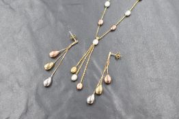 A 9ct gold three tone pebble motif necklace and earring set, the alternating yellow, rose and