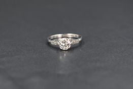 An 18ct white gold diamond set solitaire ring, the diamond measuring approximately 0.75ct, having