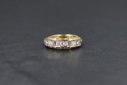 An 18ct gold diamond half eternity band, the six round brilliant cut diamonds having an