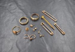 A small selection of 9ct gold and yellow metal stamped 9ct including rings, earrings, bar brooches