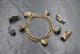 A silver double link charm bracelet having padlock clasp and eight charms, (4 loose) including