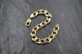 A 9ct gold large curb link bracelet, marked 375, 21.5cm, 39g