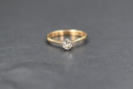 An 18ct gold diamond set solitaire ring, the old cut diamond being approximately 0.25ct in a six