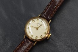 A 9ct gold Zenith wristwatch, the champagne dial having Arabic numerals, marked 375, on a brown