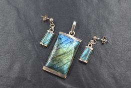 A silver mounted labrodite pendant of rectangular form, with matching earrings having stud