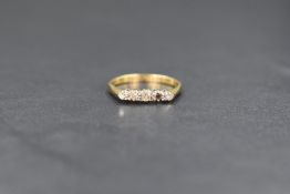 A vintage 18ct gold five stone diamond ring, one stone missing to the end, the other four stones