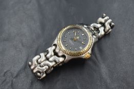 A 1990's Tag Heuer quartz wrist watch, model: WG1220-KO having a baton numeral dial with date