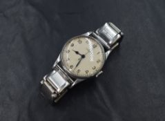 An Omega military wristwatch, the cream signed oyster dial having Arabic numerals and the reverse