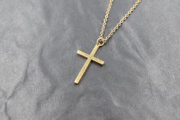 A 9ct gold cross pendant of plain form on a 9ct gold 18' chain, marked 375 and 9ct respectively,